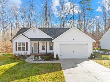 White house with brown accents, two-car garage, and a landscaped yard at 242 Delview Dr, Cherryville, NC 28021