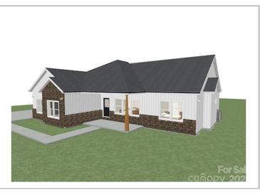 Modern farmhouse exterior with brick and siding at 1569 E Ridge Rd, Salisbury, NC 28144