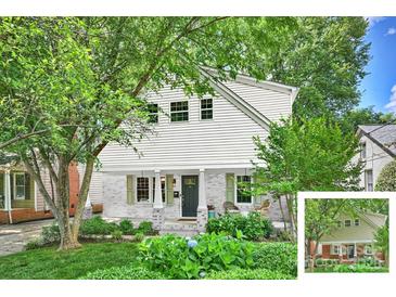 Charming two-story home featuring white siding, brick accents, inviting front porch, and a beautifully landscaped front yard at 741 Mcalway Rd, Charlotte, NC 28211