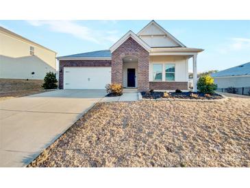 Brick front exterior of charming one-story home with landscaping and driveway at 3818 Crosshill St, Kannapolis, NC 28081