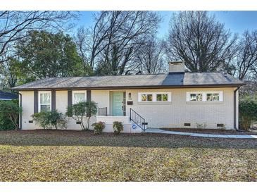 Updated Ranch home with fresh paint, landscaping, and a new walkway at 738 Brockbank Rd, Charlotte, NC 28209