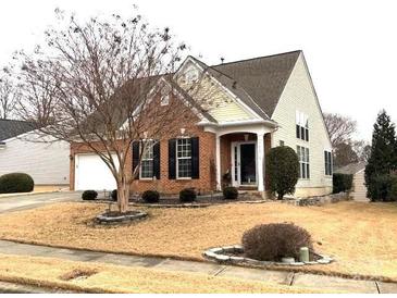 Brick ranch home with attached two-car garage and landscaping at 9021 Gander Dr, Charlotte, NC 28277