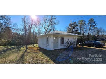 Charming cottage with freshly painted exterior and spacious yard at 153 Saluda St, Chester, SC 29706
