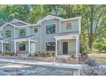 Modern three-unit townhome development with brick accents and landscaping at 1758 J Julian Ln, Charlotte, NC 28208