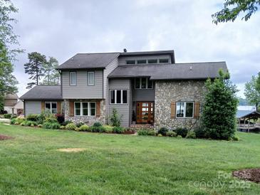 Two-story home with stone accents and landscaped lawn at 2579 Ranger Island Rd, Denver, NC 28037