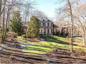 Brick house with landscaping and a large front yard at 517 Stuart Ridge None, Cramerton, NC 28032