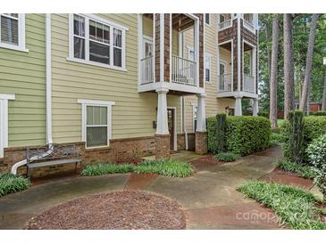 Exterior of charming townhome with walkway and landscaping at 1733-C Matheson Ave, Charlotte, NC 28205