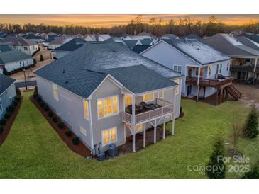 Two-story home with deck and landscaped yard, viewed from above at 45528 Misty Bluff Dr, Charlotte, NC 28278