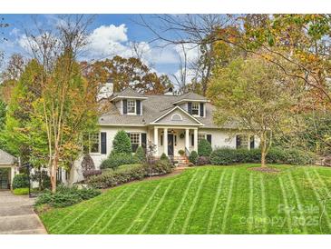 Beautiful two-story home with a spacious lawn and mature trees at 342 Wendover Hill Ct, Charlotte, NC 28211