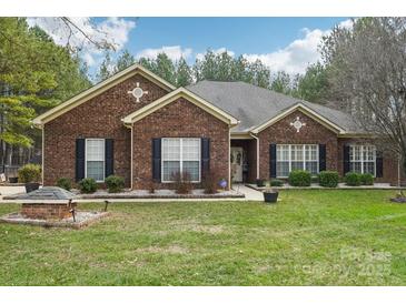 Brick ranch house with landscaped lawn and attached garage at 416 Zelkova St, York, SC 29745