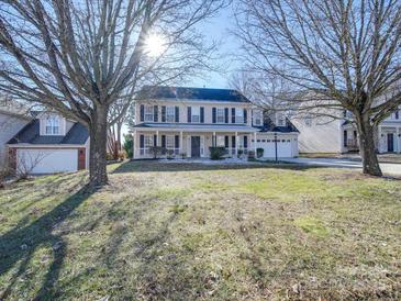 Two-story house with a front porch and attached garage, situated on a landscaped lawn at 156 Elrosa Rd, Mooresville, NC 28115