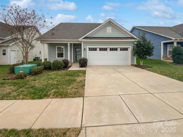 Charming one-story home with light blue siding and a two-car garage at 22433 Gateway Dr, Lancaster, SC 29720