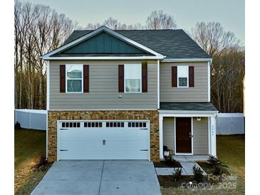 Two-story house with neutral siding, white garage door, and brown accents at 2262 Redstone Dr, York, SC 29745