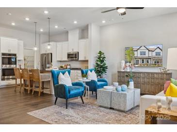 Open concept living room with kitchen and island views at 8627 Miles Gap Rd, Indian Land, SC 29707