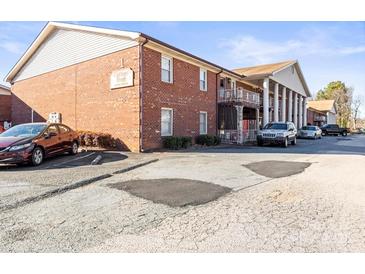 Brick apartment building with ample parking and landscaping at 2146 S Main St, Kannapolis, NC 28081