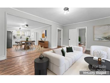 Virtually staged living room with hardwood floors at 639 Harrison St, Statesville, NC 28677