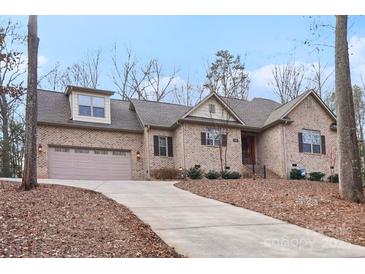 Brick house with attached garage and landscaping at 12 Tanglewood Rd, Clover, SC 29710