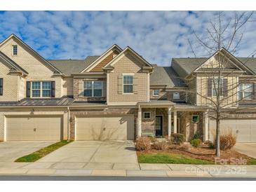 Brick front exterior of charming townhome with 2-car garage at 6014 Cadence Ln, Fort Mill, SC 29707