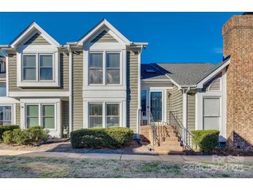 Inviting exterior of charming townhome with brick steps and landscaping at 7251 Meeting St, Charlotte, NC 28210