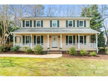 Charming two-story home with a welcoming covered front porch and beautifully landscaped yard at 761 Summerwood Dr, Rock Hill, SC 29732