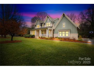 Two-story craftsman style home with a welcoming front porch at 832 Heather Ln, Charlotte, NC 28209