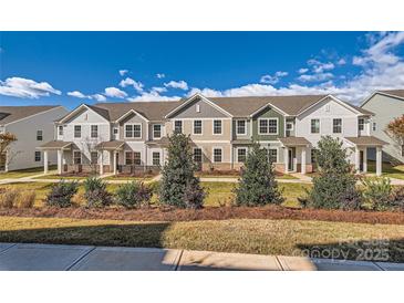 Townhouses with inviting front yards and landscaping at 9835 Old Garden Cir, Gastonia, NC 28056