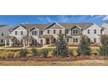 Townhouse exterior boasts a modern design and landscaping at 9839 Old Garden Cir, Gastonia, NC 28056