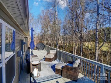 Relaxing deck with seating area and woodland views at 1259 Amberlight Cir, Salisbury, NC 28144