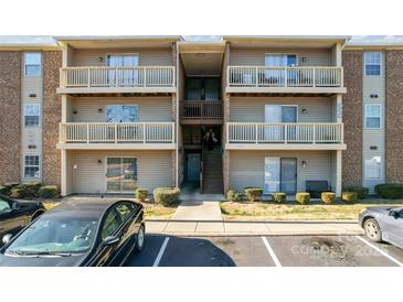 Two-story condo building with multiple units and balconies at 1620 #G Arlyn Cir, Charlotte, NC 28213