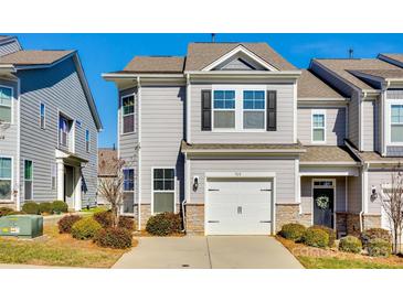 Two-story townhome with gray siding, stone accents, and a two-car garage at 919 Emma Kate Ct, Lake Wylie, SC 29710