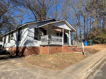 Charming one-story home with brick accents and a covered porch at 416 Richardson St, Albemarle, NC 28001