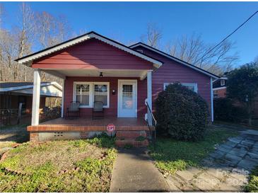 Charming red house with a covered porch and well-maintained landscaping at 518 Joe Louis St, Fort Mill, SC 29715