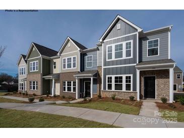 Two story townhouses with neutral siding and landscaping at 1108 Verdigris Dr # 802/0802, Gastonia, NC 28054