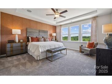 Main bedroom with large windows, a sitting area, and wood-like flooring at 3111 Beacon Heights Rd, Indian Land, SC 29707