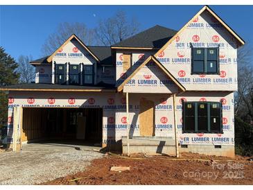 New construction home with gray exterior and a two-car garage at 426 Richards Ln, Mooresville, NC 28115