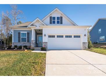 Two-story craftsman style home with a two-car garage and landscaped lawn at 15298 Windward Ln, Lancaster, SC 29720
