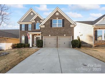 Two-story home with a three-car garage and attractive landscaping at 136 Margo Ln, Statesville, NC 28677