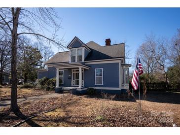 Charming two-story home with a wrap-around porch at 302 S College St, Monroe, NC 28112