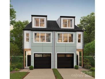 Two-story townhouses with attached garages and dormer windows at 339 Gray Dr, Charlotte, NC 28213