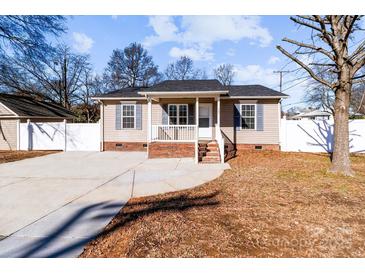 Cute ranch home with front porch, driveway and fenced yard at 700 Leonard Ave, Kannapolis, NC 28081