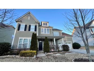 Two-story house with gray siding, black shutters, and a two-car garage at 11519 Sweet Birch Ln, Charlotte, NC 28278