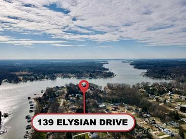 Aerial view of waterfront property with lake access and surrounding homes at 139 Elysian Dr, Mooresville, NC 28117