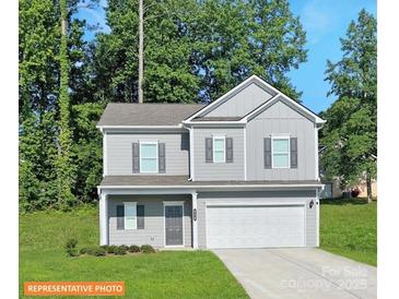 Two-story house with gray siding, two-car garage, and a well-maintained lawn at 2246 Catawba Trace Dr, Catawba, NC 28609