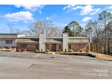 Brick condo building with parking and landscaping at 232 14Th Se Ave # E, Hickory, NC 28502