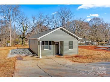 Newly constructed home with gray siding and a paved driveway at 1455 Southwest Blvd, Newton, NC 28658