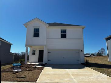 New two-story home featuring a two-car garage, white siding, and a well-manicured lawn at 214 Alden Ct, Shelby, NC 28152
