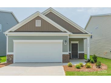 Charming single-story home with a two-car garage and beautifully landscaped front yard at 1630 Troon Dr, Salisbury, NC 28144