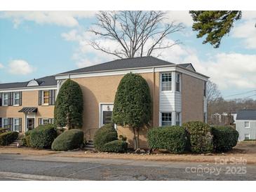 Brick ranch-style home with well-manicured landscaping at 512 Wakefield Dr, Charlotte, NC 28209