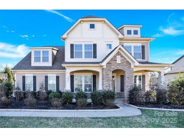 Two-story house with stone accents and a landscaped yard at 1022 Torrens Dr # 4, Monroe, NC 28110