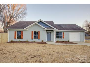 Newly built home with gray siding, brown shutters, and a landscaped yard at 2025 Sloan Dr, Charlotte, NC 28208